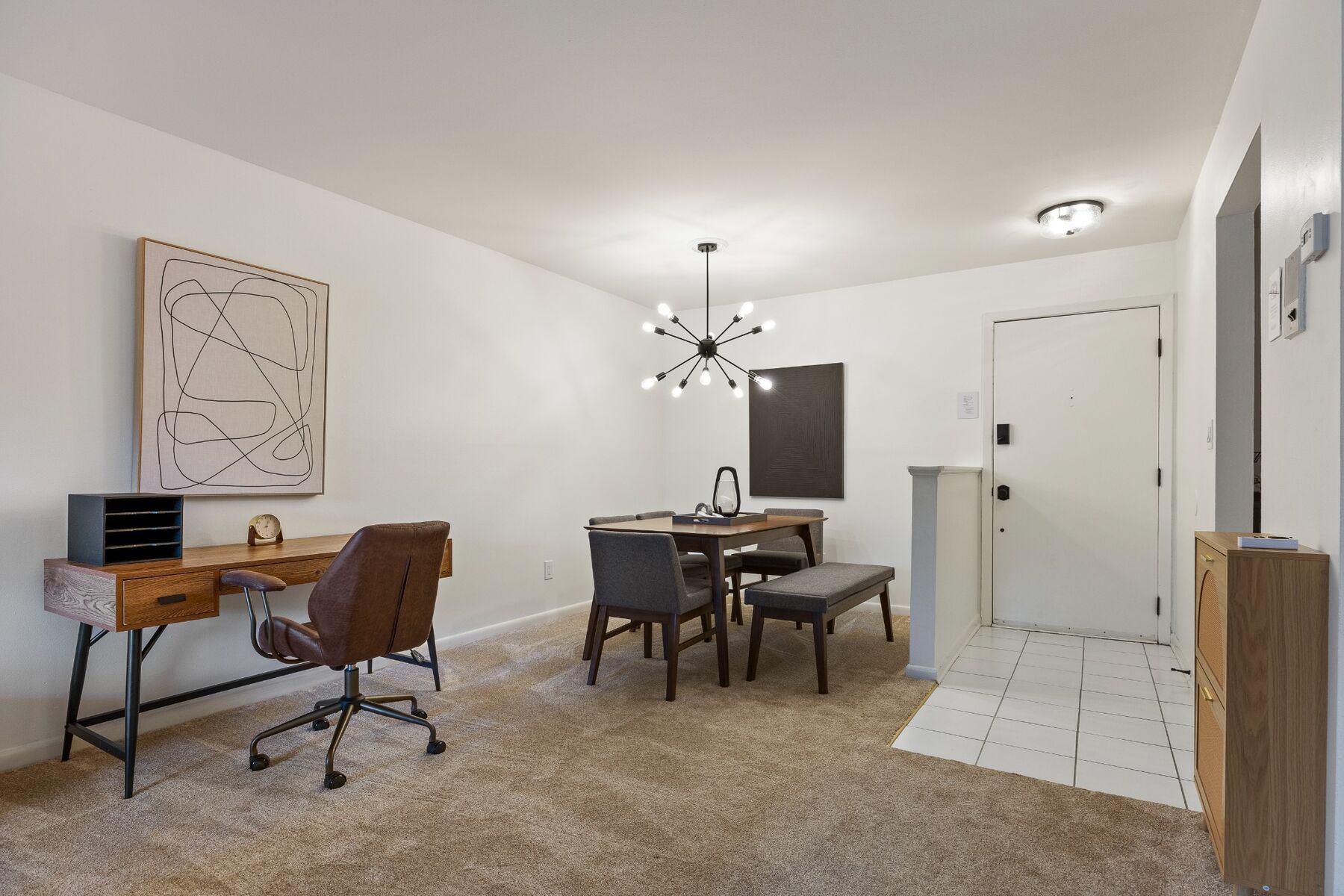 Work desk and dining area near the first-floor condo entrance