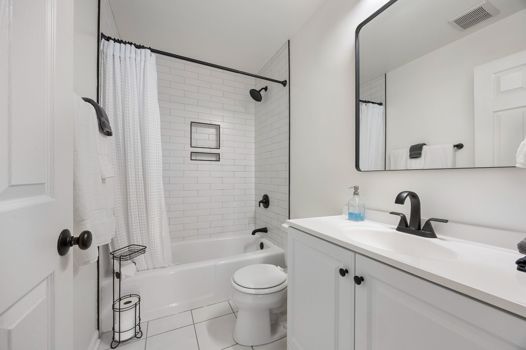 Second full bathroom with vanity and bathtub shower