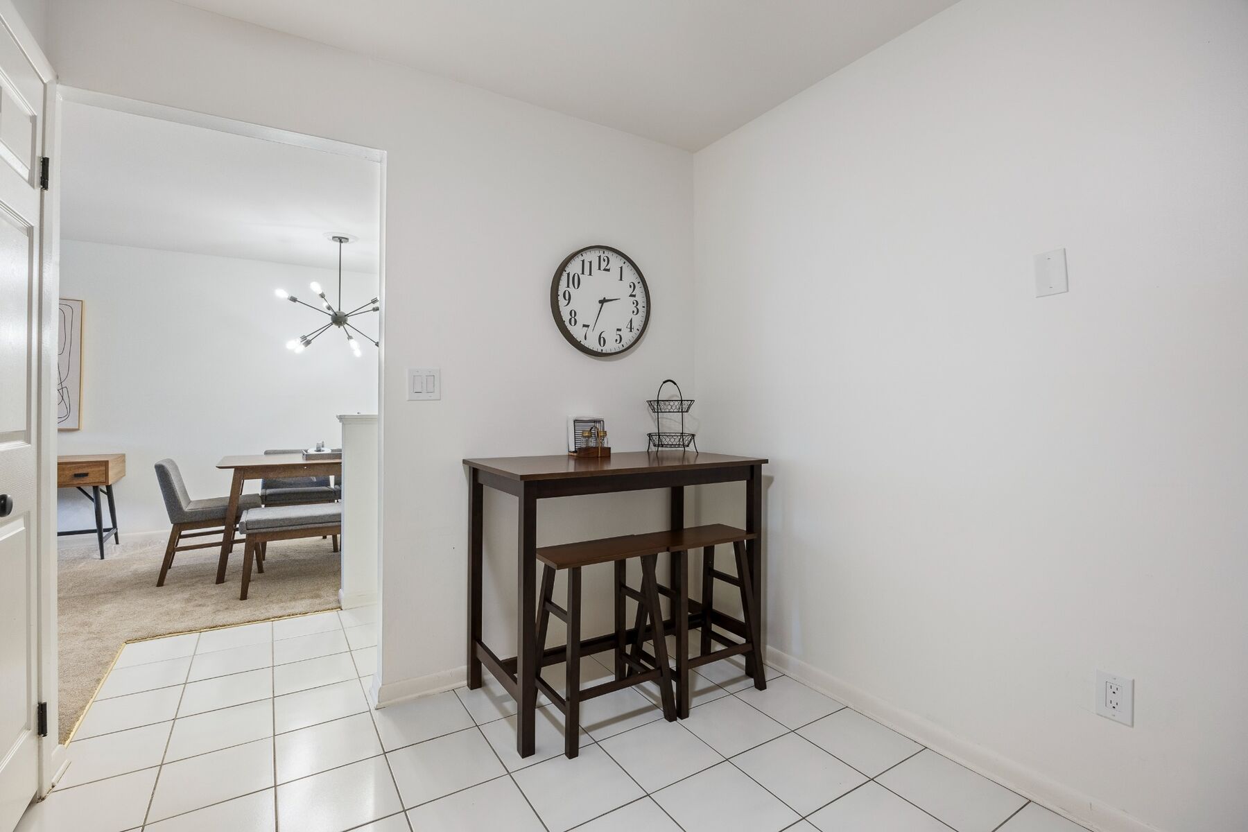 Kitchen dining nook with table and seating for two