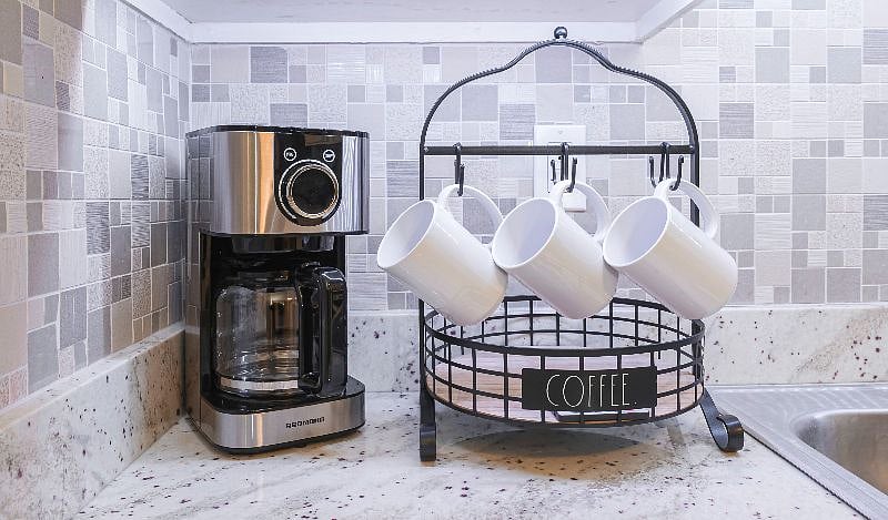 Coffee station with coffee maker and mugs