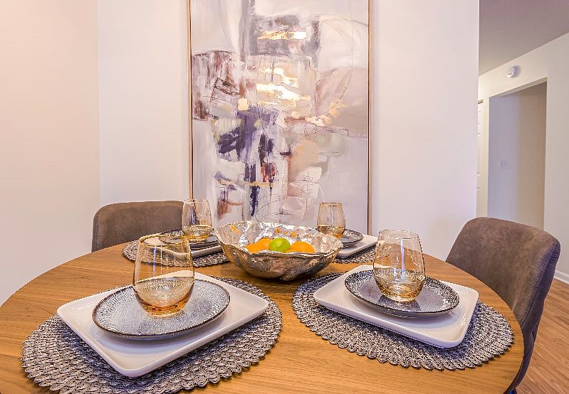 Dining table set for four in the second-floor condo